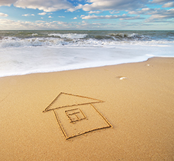 House shape drawn in the sand at the ocean near Ortley Beach