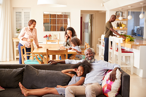 Family relaxing indoors after air conditioner repair Sea Girt